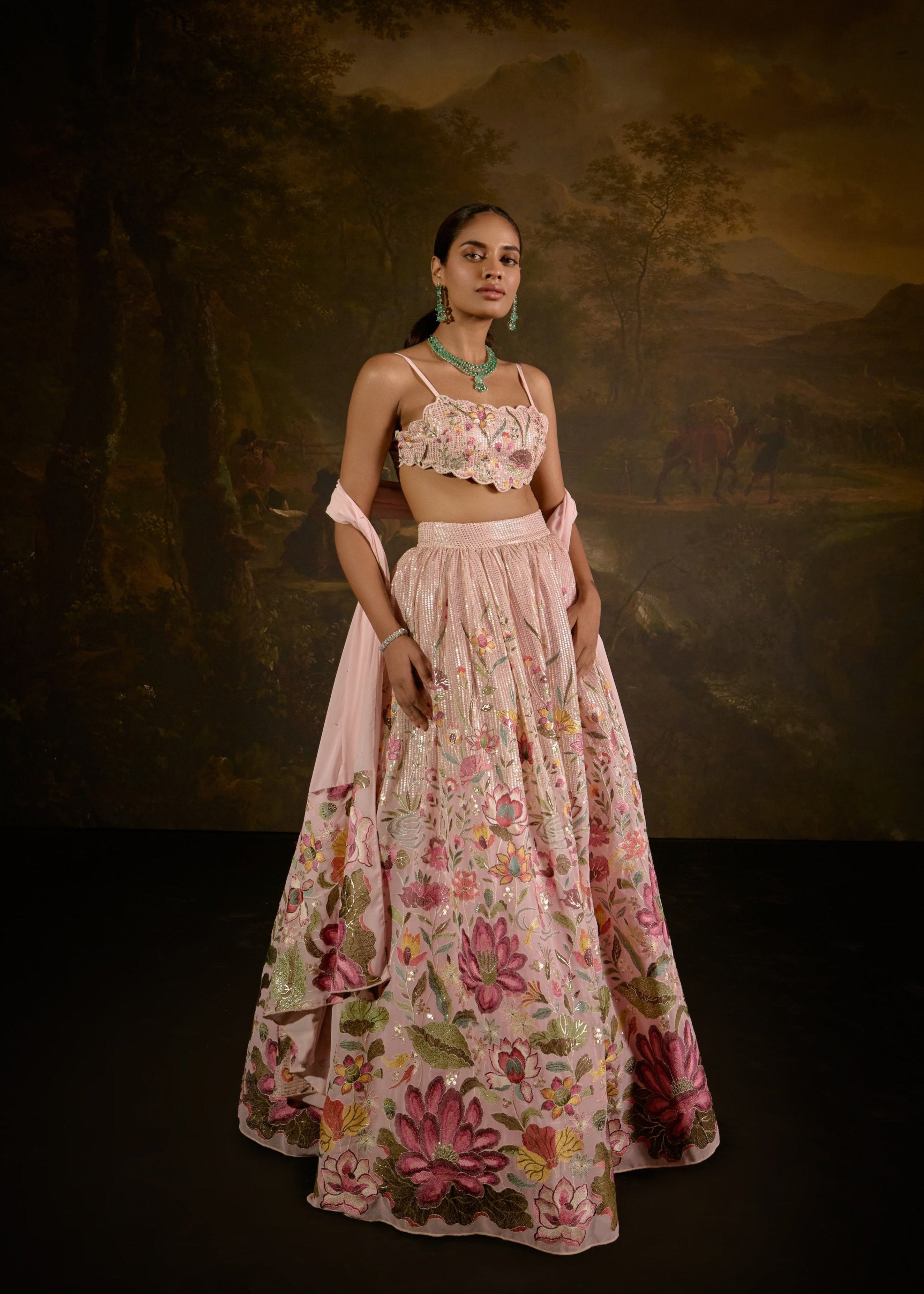 "Ahaana Pink Floral Embroidered Lehenga: Vibrant pink lehenga adorned with intricate floral embroidery for a charming and festive appeal."
