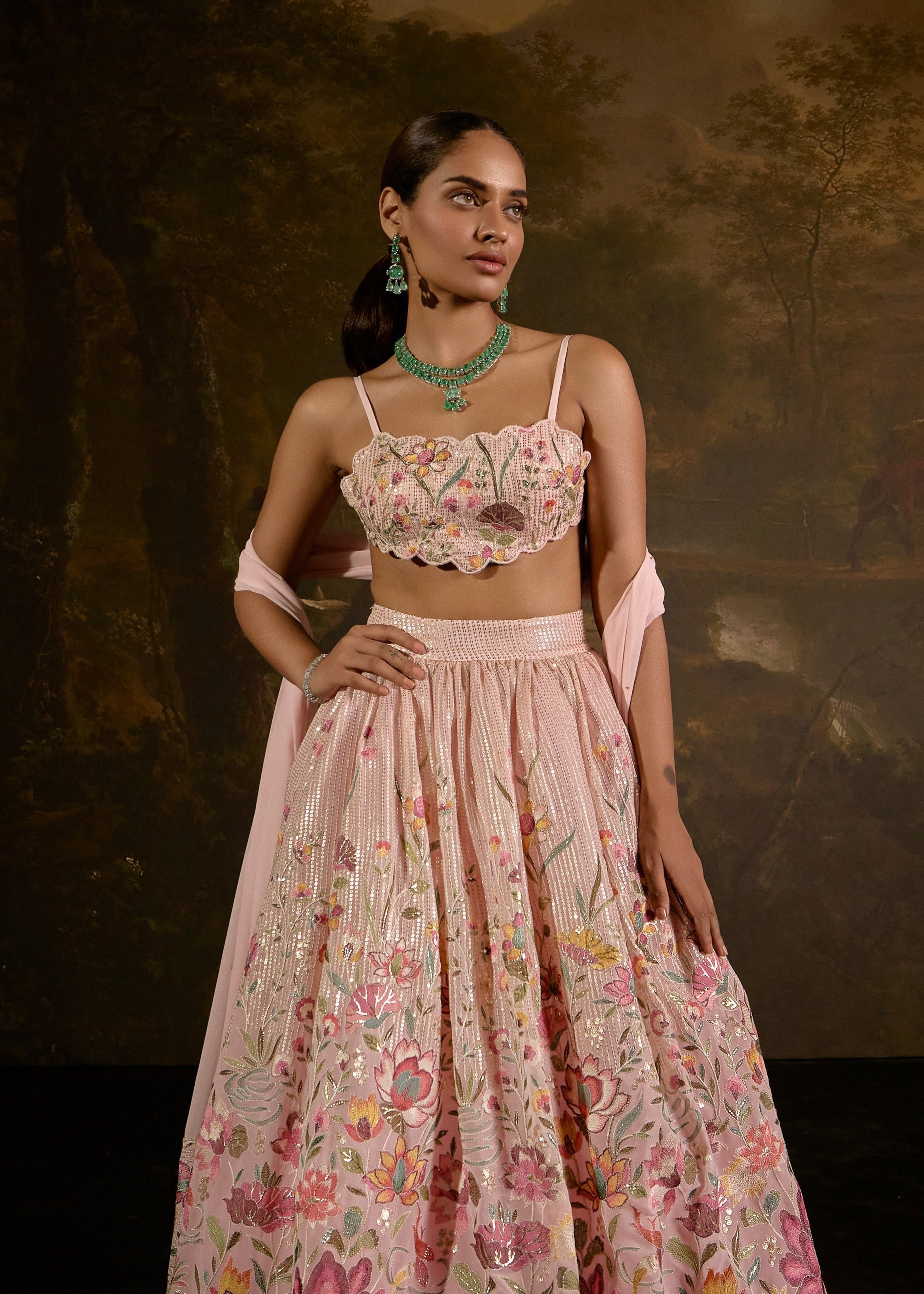 "Ahaana Pink Floral Embroidered Lehenga: Vibrant pink lehenga adorned with intricate floral embroidery for a charming and festive appeal."