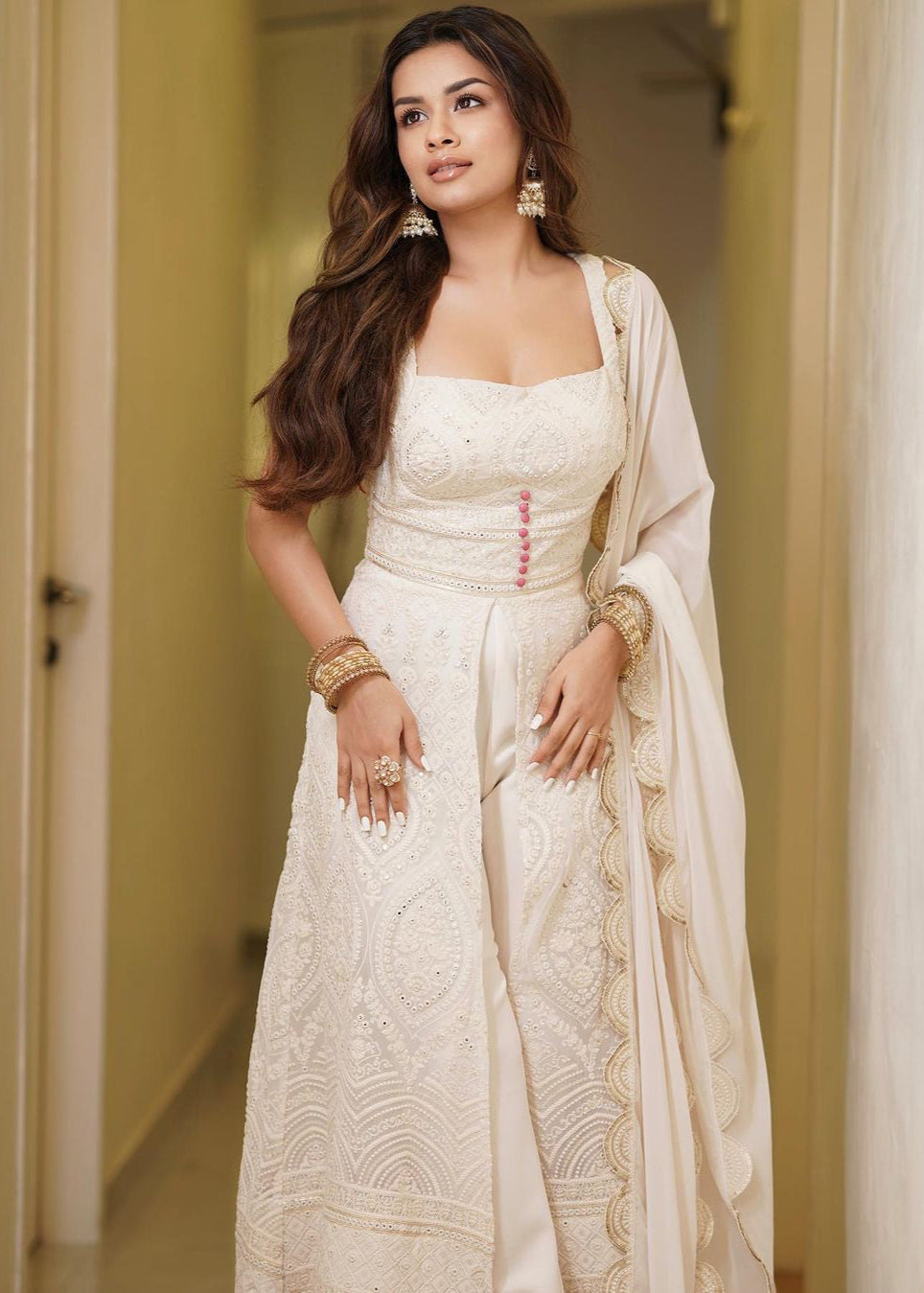Elegant woman in a Falak White Embroidered Georgette Anarkali Suit Set, radiating timeless grace and beauty