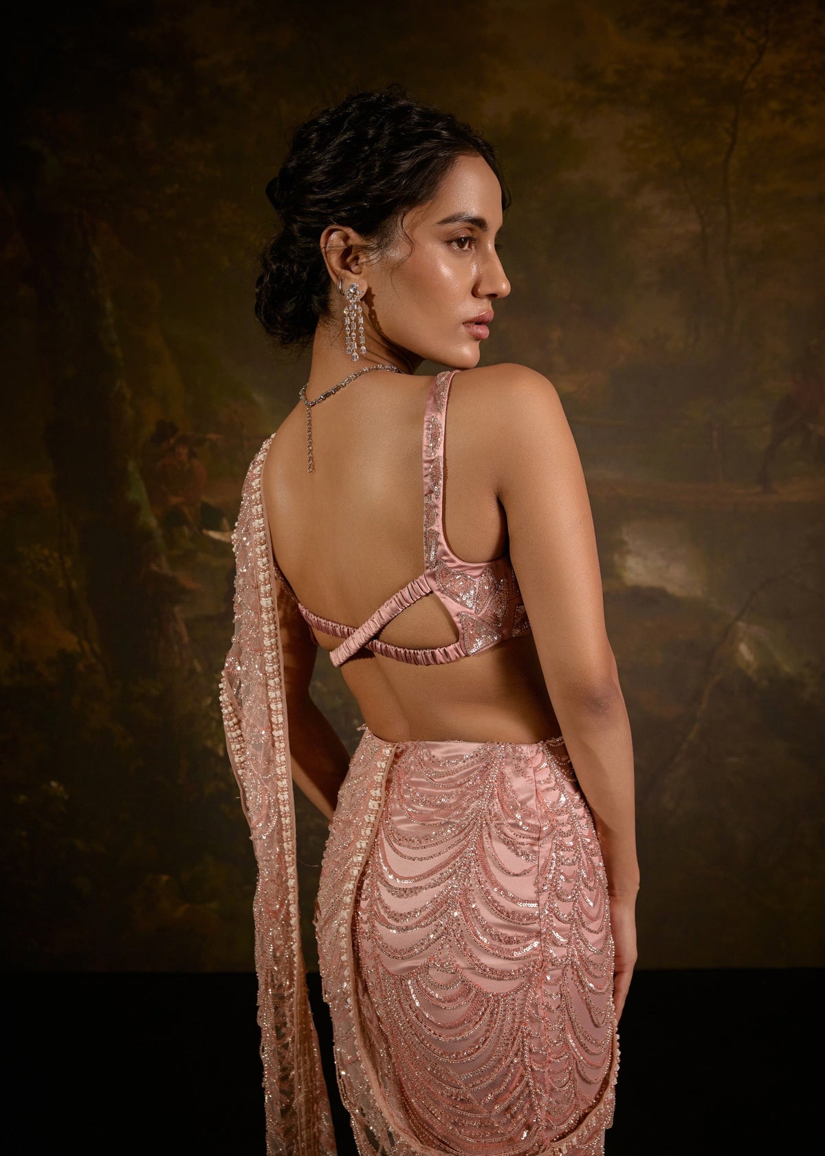 "Niyati Blush Pink Embellished Saree: Blush pink saree with intricate embellishments for a luxurious and elegant look."